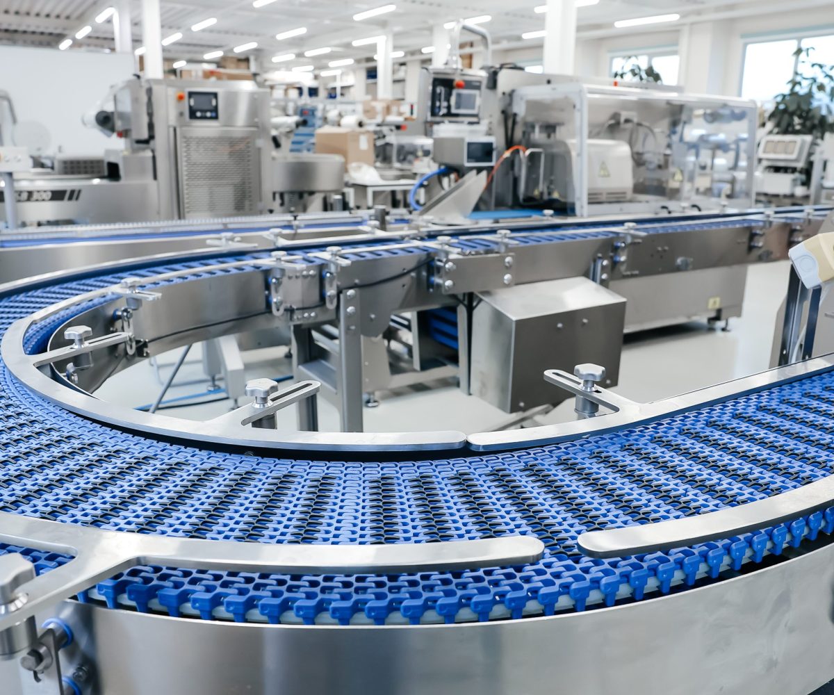 Empty modern conveyor belt of production line, part of industrial equipment in factory plant. Automatic system line